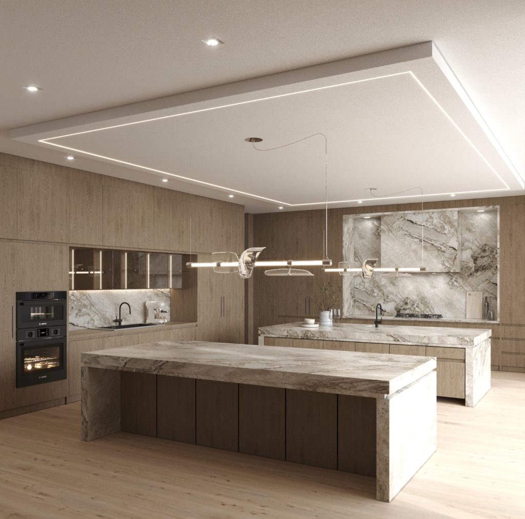 A modern kitchen with light wood cabinetry, two marble islands, built-in appliances, under-cabinet lighting, and a marble backsplash. Pendant lights hang over the islands. This space exemplifies bespoke luxury kitchens crafted by an expert kitchen renovation company.