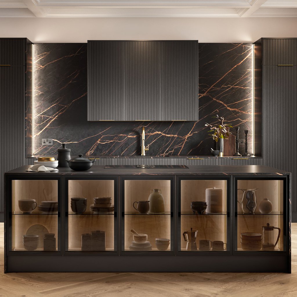 Modern kitchen with dark cabinets, glass-front island displaying pottery, a marble backsplash with copper veining, and a gold faucet under soft lighting.